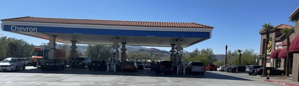 Chevron gas station triple net (NNN) investment property with multiple fuel pumps and convenience retail in a high-traffic location.